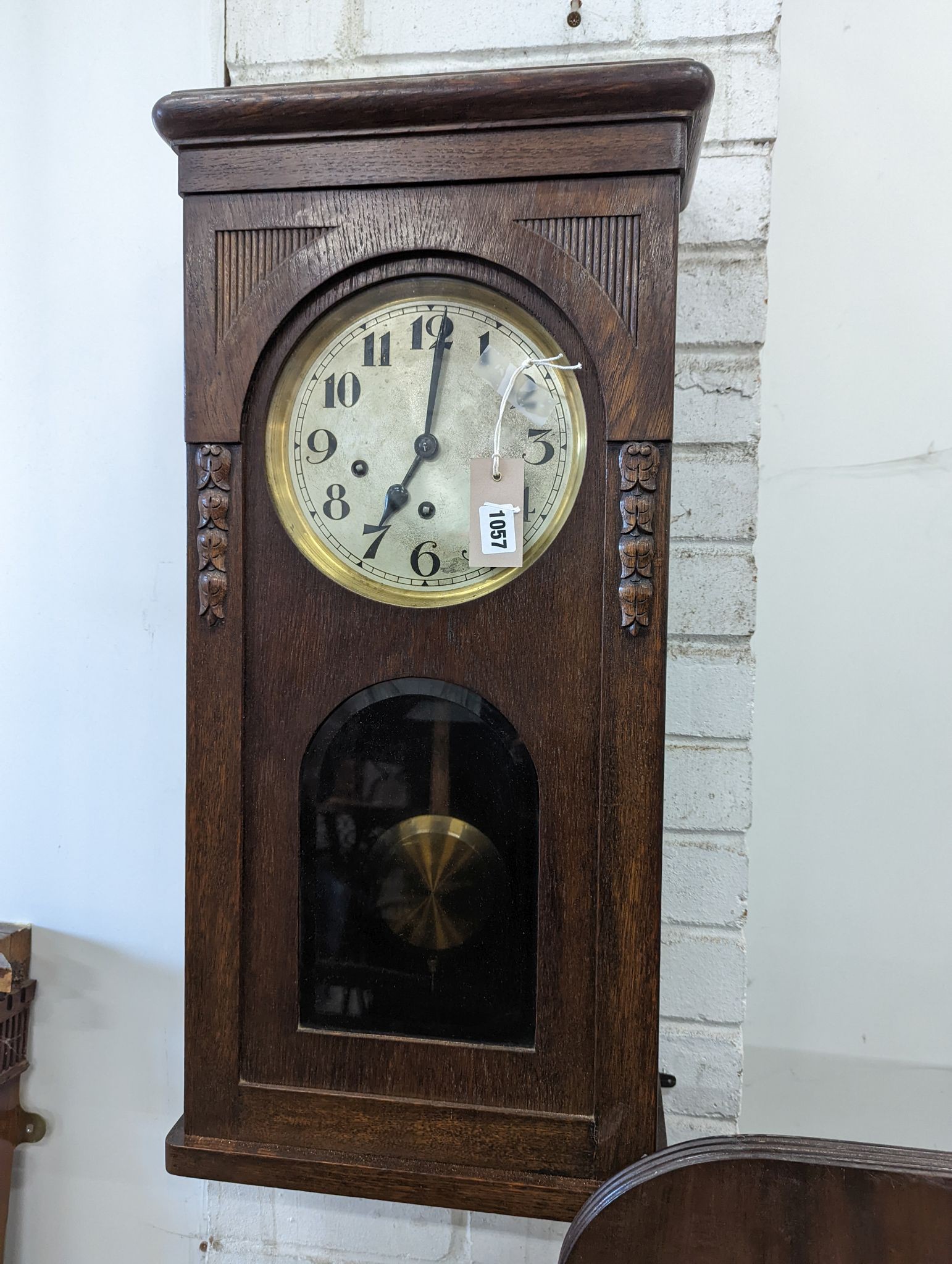A 1920's oak cased wall clock, height 80cm